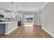 Spacious open floorplan, with luxury vinyl plank flooring, and sliding glass doors at 107 Deans Ct., Green Sea, SC 29545
