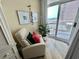 Comfortable corner for reading with ocean views from sliding glass doors to the balcony at 2504 N Ocean Blvd. # 734, Myrtle Beach, SC 29577