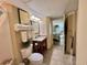 Cozy bathroom with tile flooring, granite countertop vanity, toilet, and doorway to bedroom at 2504 N Ocean Blvd. # 734, Myrtle Beach, SC 29577
