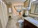 Well-lit bathroom with a full tub and shower, granite countertop, and ample storage space at 2504 N Ocean Blvd. # 734, Myrtle Beach, SC 29577