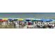 Inviting beach scene with colorful umbrellas and relaxed beachgoers soaking up the sun by the water at 2504 N Ocean Blvd. # 734, Myrtle Beach, SC 29577