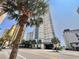 An exterior view of the high-rise resort property with palm trees and a clear blue sky at 2504 N Ocean Blvd. # 734, Myrtle Beach, SC 29577