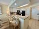 Bright kitchen boasts granite counters, white cabinets, and a breakfast bar with seating at 2504 N Ocean Blvd. # 734, Myrtle Beach, SC 29577