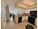 The kitchen features white cabinets, granite countertops, and black appliances at 2504 N Ocean Blvd. # 734, Myrtle Beach, SC 29577