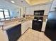 Bright kitchen with white cabinetry, granite counters, and stainless steel sink at 2504 N Ocean Blvd. # 734, Myrtle Beach, SC 29577