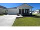 Charming single-story home with stone accents, a two-car garage, and a beautifully manicured lawn at 5026 Valley Falls St., Myrtle Beach, SC 29579