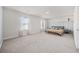 Spacious bedroom featuring neutral walls and carpet with 2 large windows at 128 Caveson Way, Conway, SC 29526