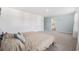 Comfortable bedroom featuring neutral walls and carpet with a light blue accent wall at 128 Caveson Way, Conway, SC 29526