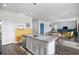 Eat-in kitchen featuring an island with stainless steel appliances and a combined dining and living area at 128 Caveson Way, Conway, SC 29526