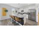 Modern kitchen with stainless steel appliances, granite countertops, and a large island with seating for four at 128 Caveson Way, Conway, SC 29526