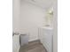 Bright laundry room with modern washer, dryer and gray flooring at 128 Caveson Way, Conway, SC 29526