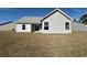 The home's backyard featuring white siding and complemented by large windows at 1248 Wehler Ct., Conway, SC 29526