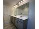 Bathroom featuring a double vanity with gray cabinets, tile flooring and a shower-tub combo at 1248 Wehler Ct., Conway, SC 29526