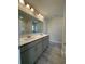 Bathroom with double vanity with gray cabinets and shower-tub combo at 1248 Wehler Ct., Conway, SC 29526