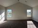 Carpeted bedroom featuring natural light from two bright windows and high ceilings at 1248 Wehler Ct., Conway, SC 29526