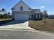 Inviting single-Gathering home with a spacious driveway, stone accents and two-car garage at 1248 Wehler Ct., Conway, SC 29526