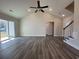 Bright living room with vaulted ceiling, modern ceiling fan, and sliding glass doors at 1248 Wehler Ct., Conway, SC 29526
