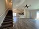 Open concept living room with vaulted ceilings, wood flooring, and staircase at 1248 Wehler Ct., Conway, SC 29526