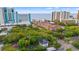 Aerial view of a beachside property with lush greenery and nearby hotels in the distance at 412 29Th Ave. N, Myrtle Beach, SC 29577