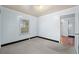 Small empty bedroom with grey carpet and a window with mini blinds at 412 29Th Ave. N, Myrtle Beach, SC 29577