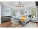 Light blue bedroom featuring a ceiling fan, wood floors, and neutral decor at 412 29Th Ave. N, Myrtle Beach, SC 29577