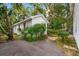 Side view of house surrounded by lush landscaping and a paved driveway at 412 29Th Ave. N, Myrtle Beach, SC 29577