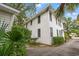 Two-story home with white siding, surrounded by trees and landscaping at 412 29Th Ave. N, Myrtle Beach, SC 29577