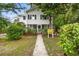 Inviting two-story home with a pathway leading to the front door and well-maintained landscaping at 412 29Th Ave. N, Myrtle Beach, SC 29577