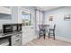 Cozy kitchen nook with a breakfast table, chairs, and natural light streaming through the windows at 412 29Th Ave. N, Myrtle Beach, SC 29577