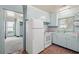 Outdated light blue kitchen with white appliances and plaid flooring at 412 29Th Ave. N, Myrtle Beach, SC 29577