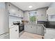 Functional kitchen with gray cabinetry, granite countertops, and appliances at 412 29Th Ave. N, Myrtle Beach, SC 29577