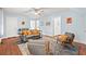 Bright living room with light blue walls, ceiling fan, hardwood floors, and stylish furnishings at 412 29Th Ave. N, Myrtle Beach, SC 29577