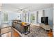 Inviting living room featuring hardwood floors, area rug, comfortable sofa, and streaming sunlight at 412 29Th Ave. N, Myrtle Beach, SC 29577