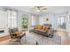 Inviting living area with a neutral sofa, hardwood floors, and a view of the screened porch at 412 29Th Ave. N, Myrtle Beach, SC 29577