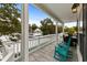 Relaxing outdoor balcony featuring vibrant blue rocking chairs and a scenic view of the surrounding neighborhood at 6001 - N14 S Kings Hwy., Myrtle Beach, SC 29575