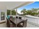 Inviting outdoor balcony with a dining table and chairs, offering a comfortable space for outdoor meals at 6001 - N14 S Kings Hwy., Myrtle Beach, SC 29575