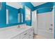 Bright bathroom featuring a white vanity, bath tub with shower, and neutral tile flooring at 6001 - N14 S Kings Hwy., Myrtle Beach, SC 29575
