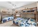 Spacious bedroom with two sets of bunk beds and coastal-themed decor at 6001 - N14 S Kings Hwy., Myrtle Beach, SC 29575
