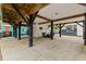 Spacious carport area featuring wood beams, concrete flooring, an outdoor seating area, and ample parking space at 6001 - N14 S Kings Hwy., Myrtle Beach, SC 29575