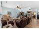 Comfortable living room with wood flooring, a staircase, and beach-themed decor for a relaxing ambiance at 6001 - N14 S Kings Hwy., Myrtle Beach, SC 29575