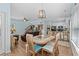 Open living space with dining area, living room, and kitchen, wood floors and bright lighting at 6001 - N14 S Kings Hwy., Myrtle Beach, SC 29575