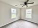Inviting bedroom with two bright windows, offering natural light and a refreshing view to enhance comfort at 6306 Somerset Dr., Myrtle Beach, SC 29572
