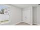 Clean, bright bedroom featuring a window with blinds and a double-door closet at 512 9Th Ave. S, North Myrtle Beach, SC 29582