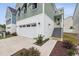 Charming two-story home with a white garage door and welcoming front entrance at 512 9Th Ave. S, North Myrtle Beach, SC 29582