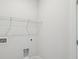 A bright laundry room offers essential connections for washer/dryer units at 512 9Th Ave. S, North Myrtle Beach, SC 29582