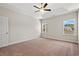 Spacious main bedroom with two windows overlooking the exterior at 6025 Flossie Rd., Conway, SC 29527