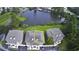 Aerial view of property highlighting building's location near a pond and surrounding complex at 4290 Pinehurst Circle # B6, Little River, SC 29566