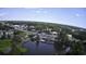 Aerial view of neighborhood with a variety of tree coverage and pond at 4290 Pinehurst Circle # B6, Little River, SC 29566