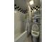 Bathroom with checkered accent and a shower with a white surround and chrome fixtures at 4290 Pinehurst Circle # B6, Little River, SC 29566