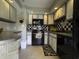 Nicely appointed kitchen with black appliances, tile backsplash, and ample counter space at 4290 Pinehurst Circle # B6, Little River, SC 29566